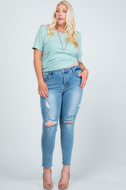 Mid Rise Distressed Skinny Jeans